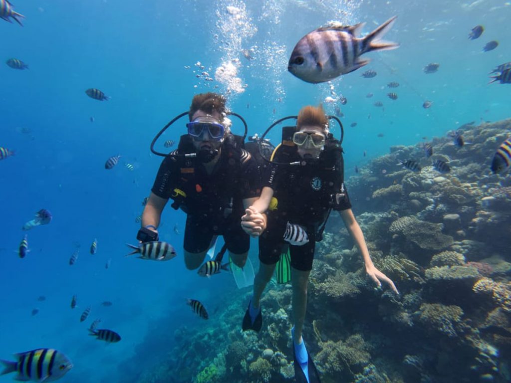 Open Water student practicing a skill with an instructor in Hurghada