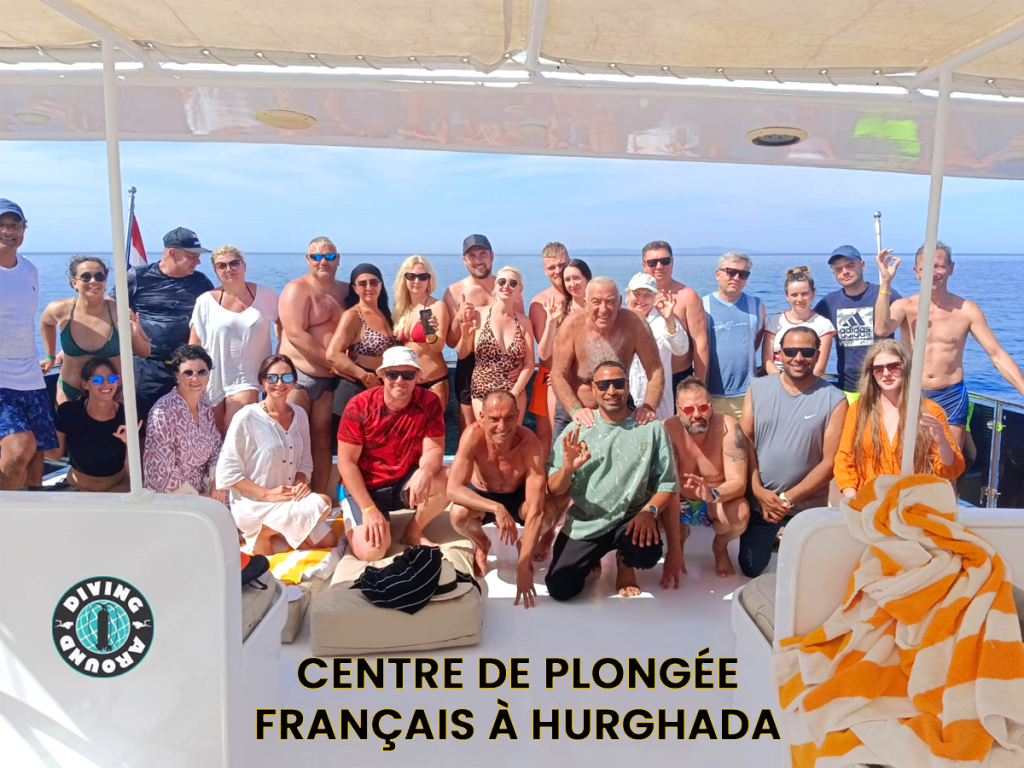 large group of divers gearing up on the spacious deck of a Hurghada dive boat