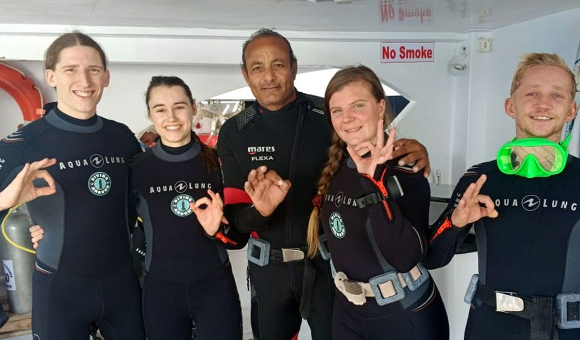 Dive boat in Hurghada with divers gearing up for a Red Sea dive Diving Hurghada Prices