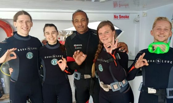 Dive boat in Hurghada with divers gearing up for a Red Sea dive Diving Hurghada Prices