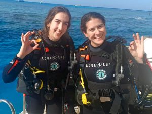 Women divers relaxing on Hurghada dive boat between Red Sea dives