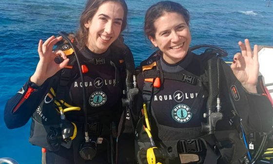 Women divers relaxing on Hurghada dive boat between Red Sea dives