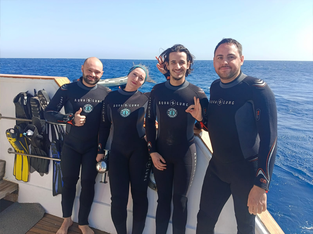 Happy divers on a diving boat in Hurghada