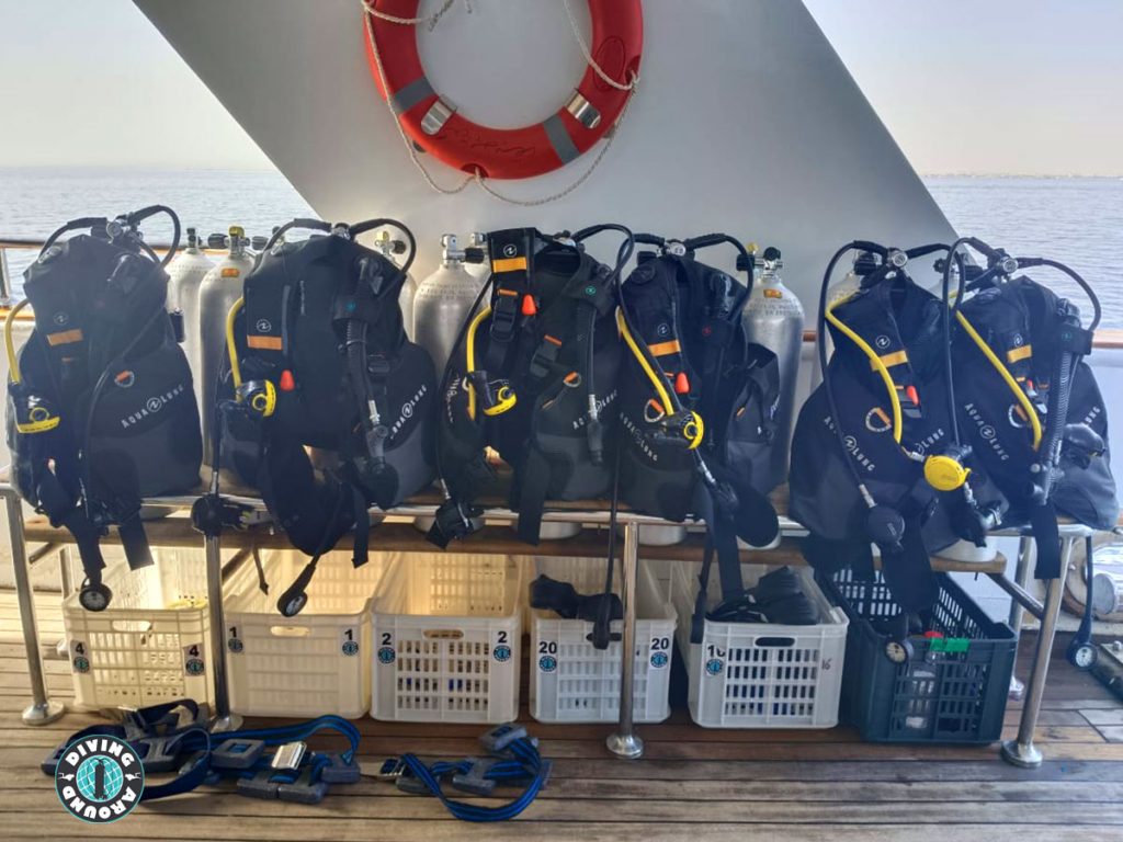 Spacious dive deck of a Hurghada daily diving boat, with organized gear setup