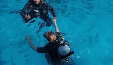 Beginner diver with instructor on Hurghada coral reef Diving Courses and Certifications in Hurghada